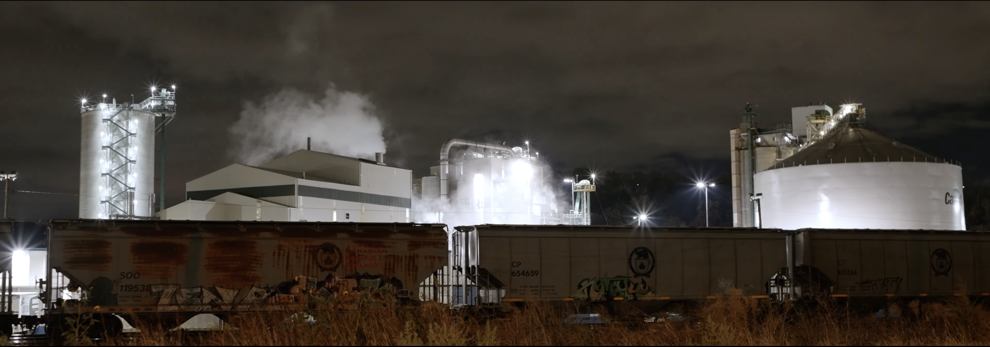 Industrial rail yard at night